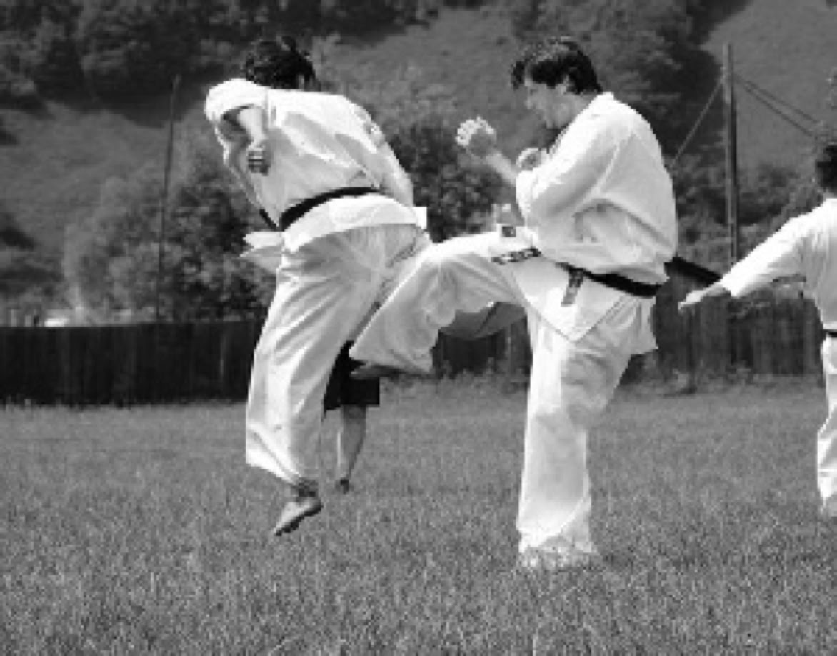 Lucian Herlo-Deleanu practicing Kyokushinkai karate Kumite, lowkick.